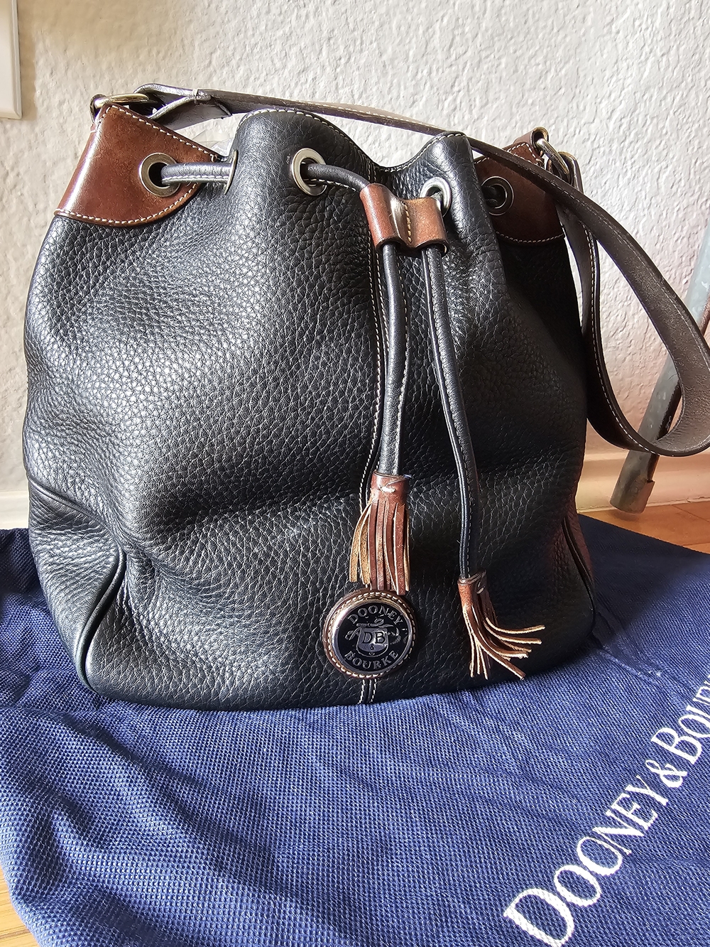 Dooney & Bourke Black and Brown Pebbled Leather Drawstring Shoulder Bag